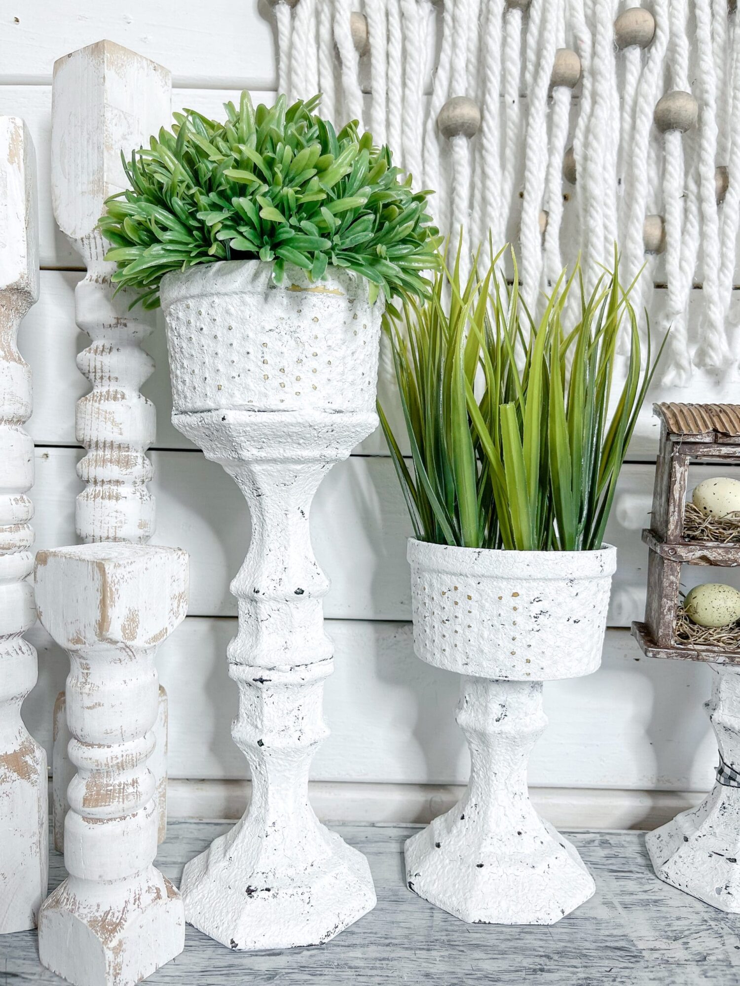 DIY Dollar Tree project with containers glued to candlesticks and then all painted with chalk paint to create a farmhouse look.